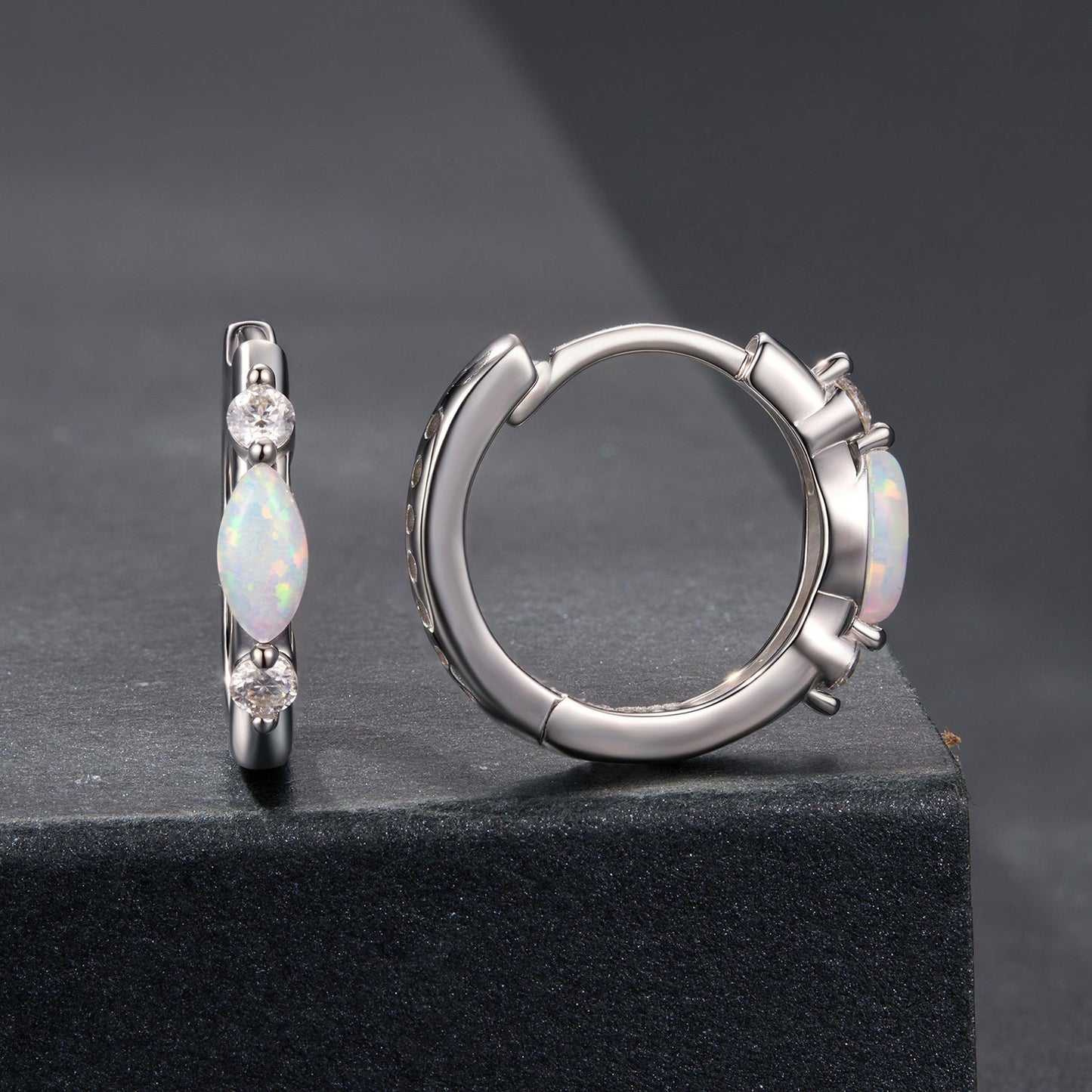 Pair of 925 sterling silver earrings with opal drops and moissanite accents, white gold plated on Tampa Home & Garden Store