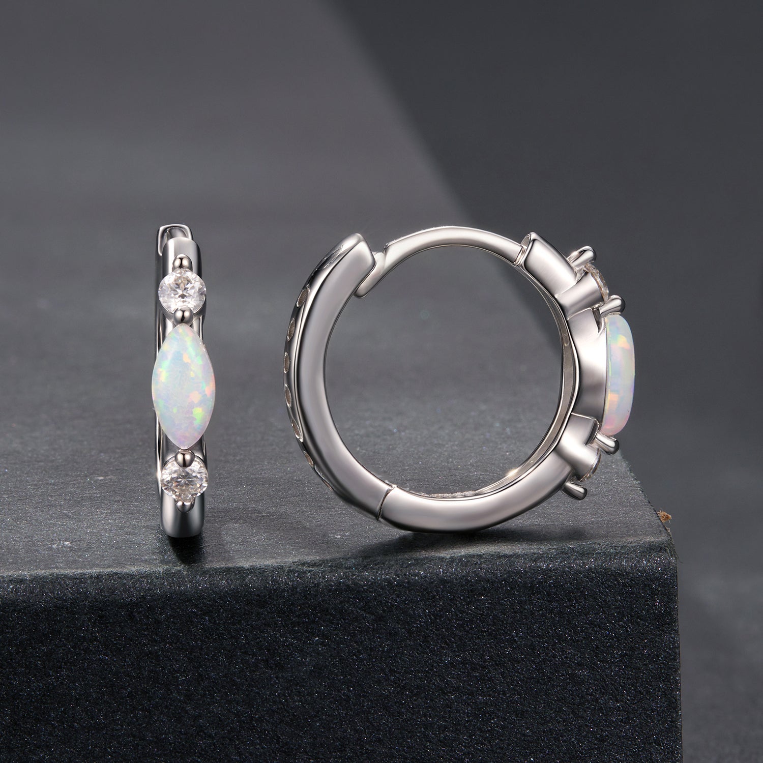 Pair of 925 sterling silver earrings with opal drops and moissanite accents, white gold plated on Tampa Home & Garden Store