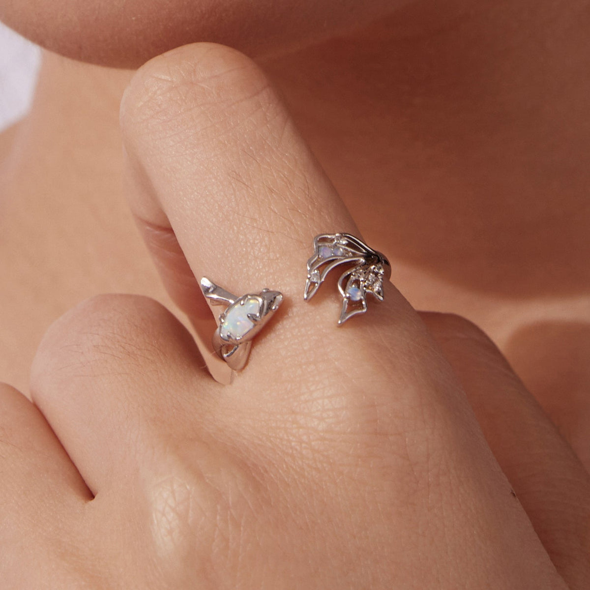 Set of 2 sterling silver rings with white opal bezel and CZ floral cluster designs on Tampa Home & Garden Store