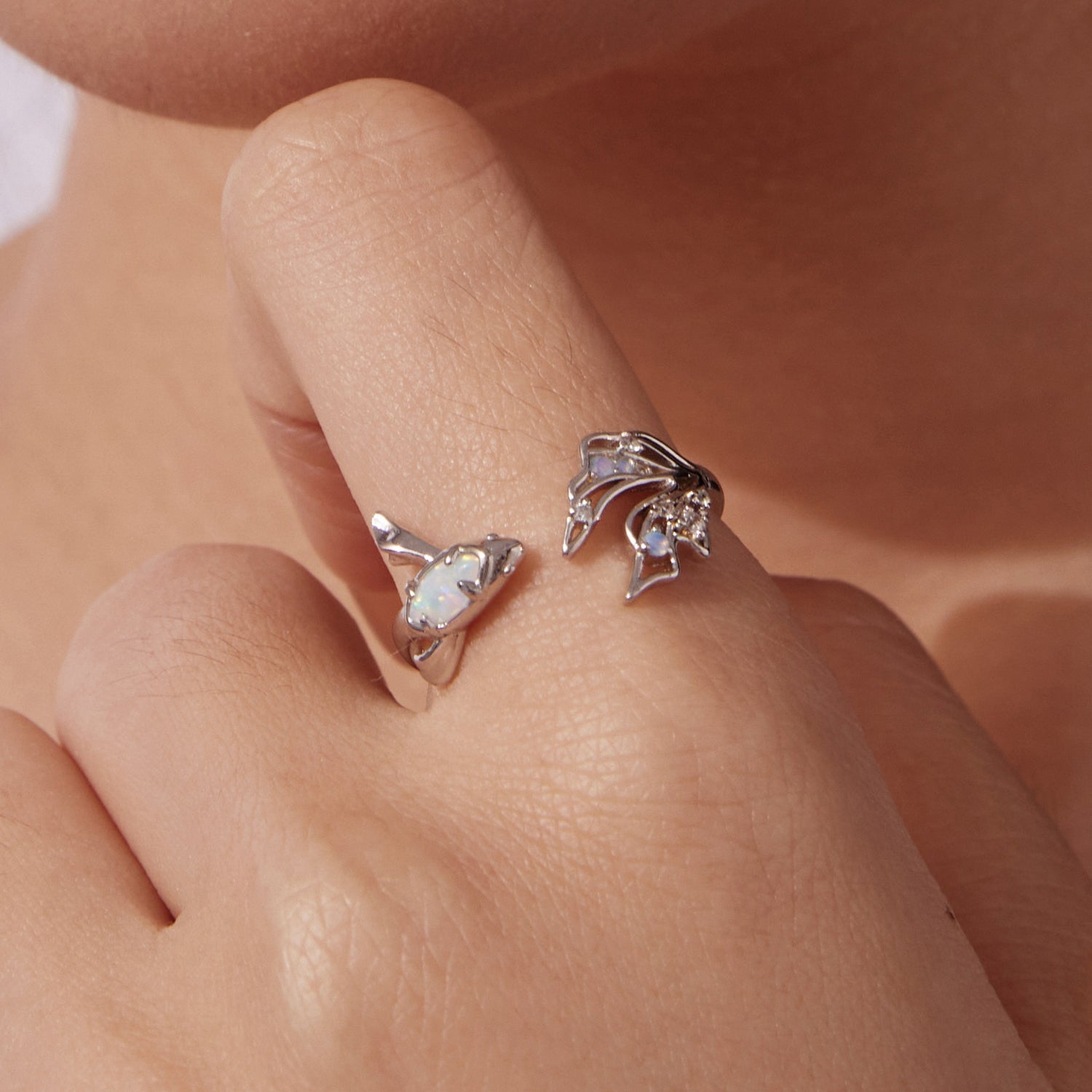 Set of 2 sterling silver rings with white opal bezel and CZ floral cluster designs on Tampa Home & Garden Store