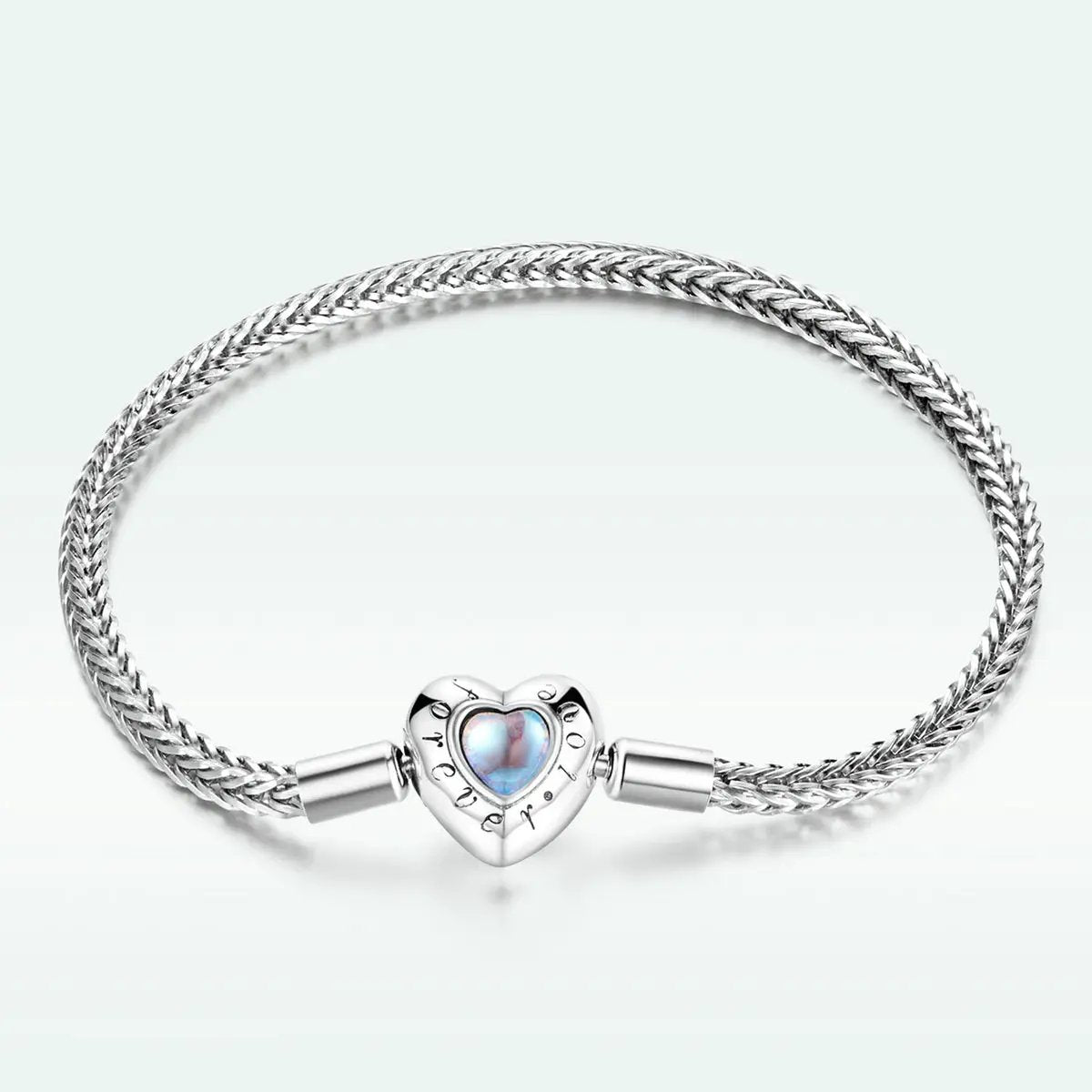 Sterling silver moonstone bracelet with braided chain and heart charm on Tampa Home & Garden Store