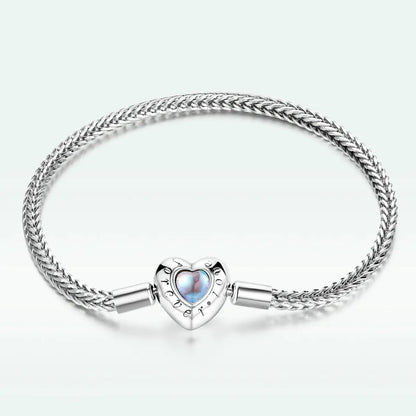 Sterling silver moonstone bracelet with braided chain and heart charm on Tampa Home & Garden Store