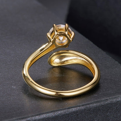Gold-tone moissanite ring with a round center stone set in a four-prong head by Bids.com on Tampa Home & Garden Store