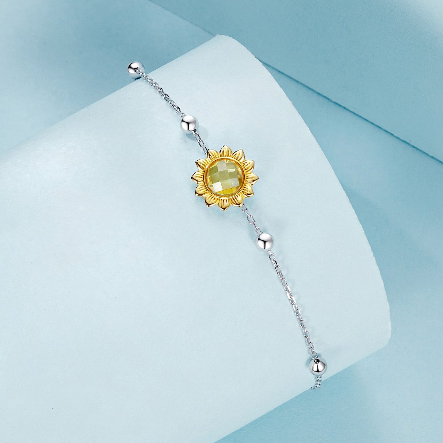 Bracelet with sunflower pendant in gold-tone and yellow glass center on silver chain on Tampa Home & Garden Store