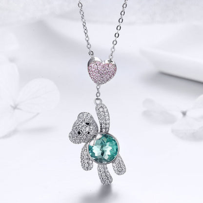 Sterling silver necklace with pink crystal heart and panda charm, teal belly gemstone on Tampa Home & Garden Store