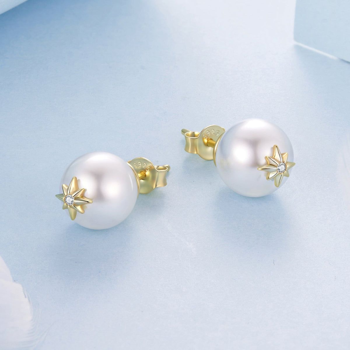 Earrings, pair of 925 sterling silver studs with large white pearl and gold starburst CZ accents on Tampa Home & Garden Store