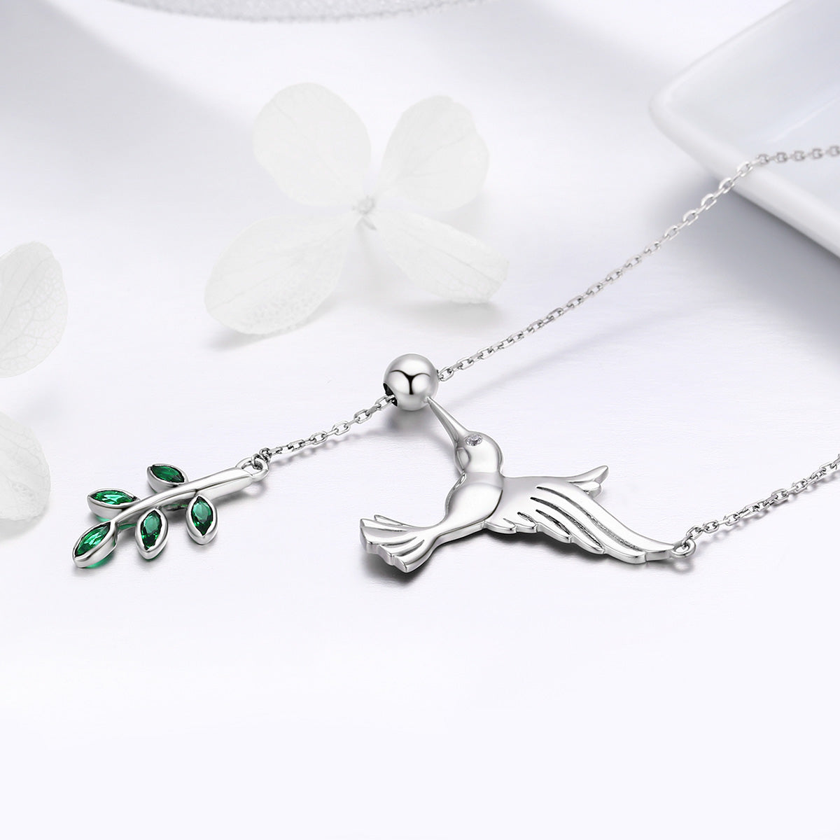 Sterling silver bird pendant necklace with leaves and green gemstones on Tampa Home & Garden Store
