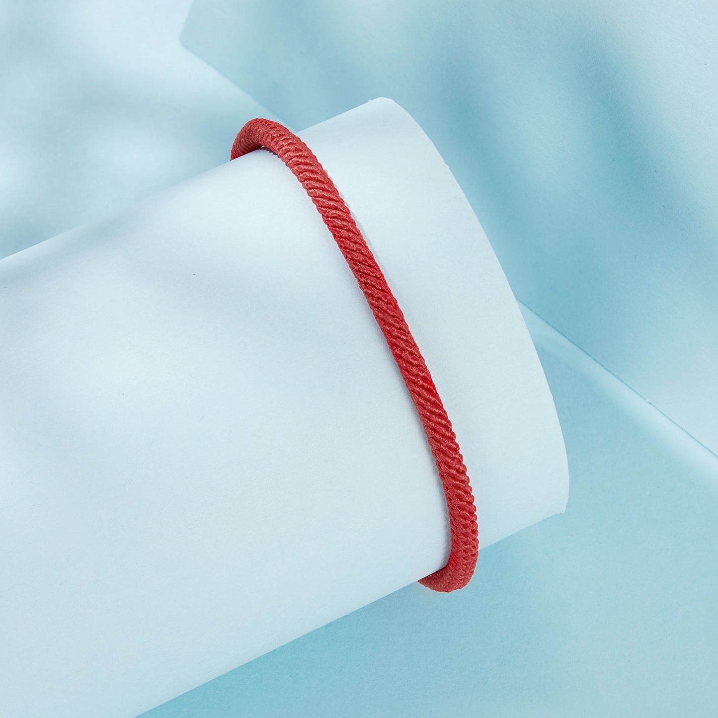Bracelet men's red rope with twisted-cord texture displayed on light blue backdrop on Tampa Home & Garden Store