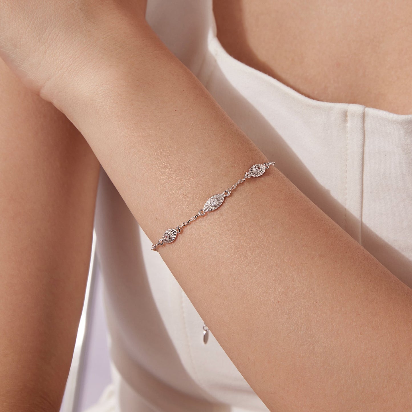 Bracelet 925 sterling silver white gold plated with CZ pendants on a woman's wrist on Tampa Home & Garden Store