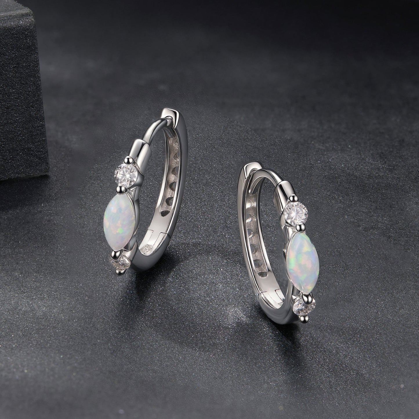 Earrings by Bids.com, 925 sterling silver white gold plated with opal drops and moissanite on Tampa Home & Garden Store