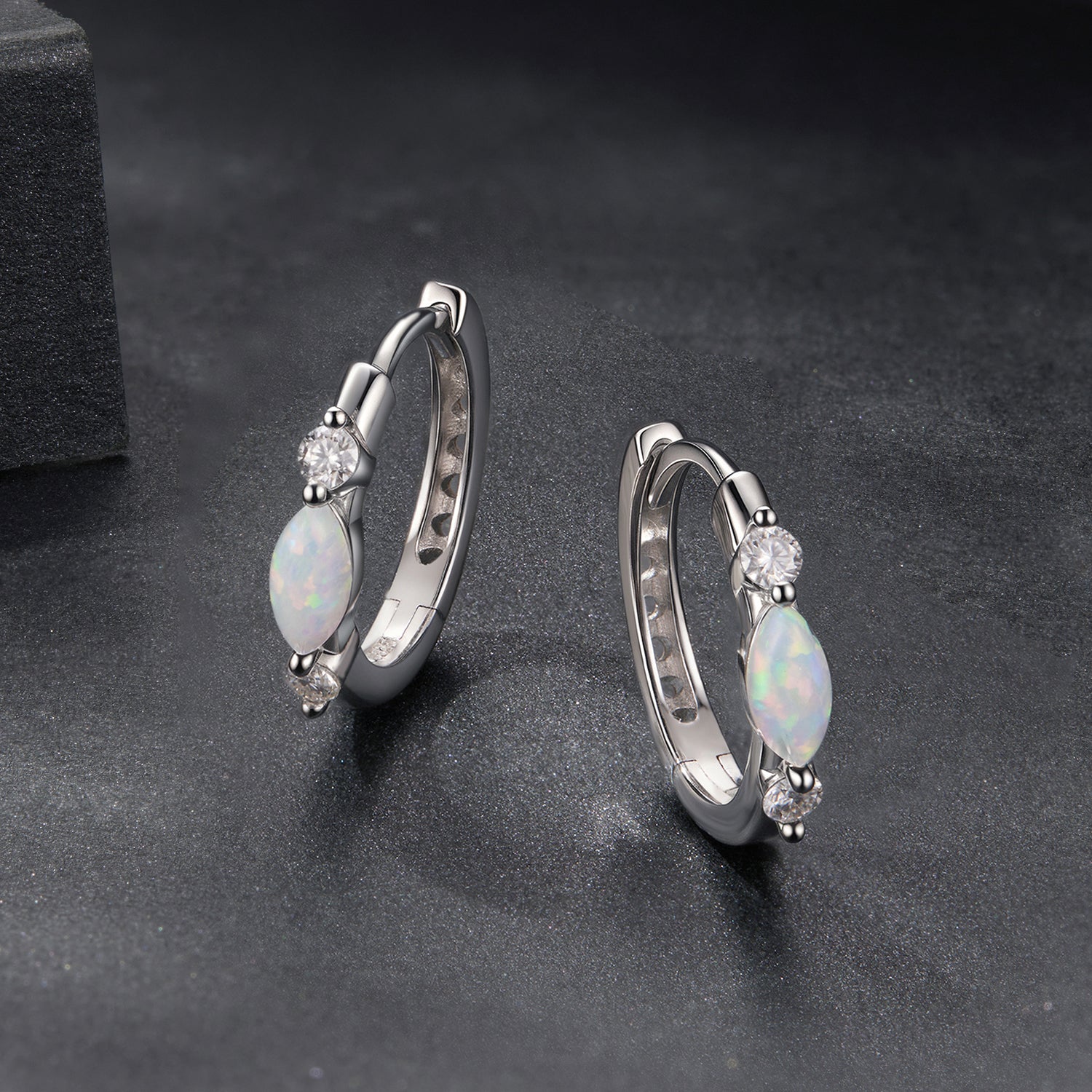 Earrings by Bids.com, 925 sterling silver white gold plated with opal drops and moissanite on Tampa Home & Garden Store