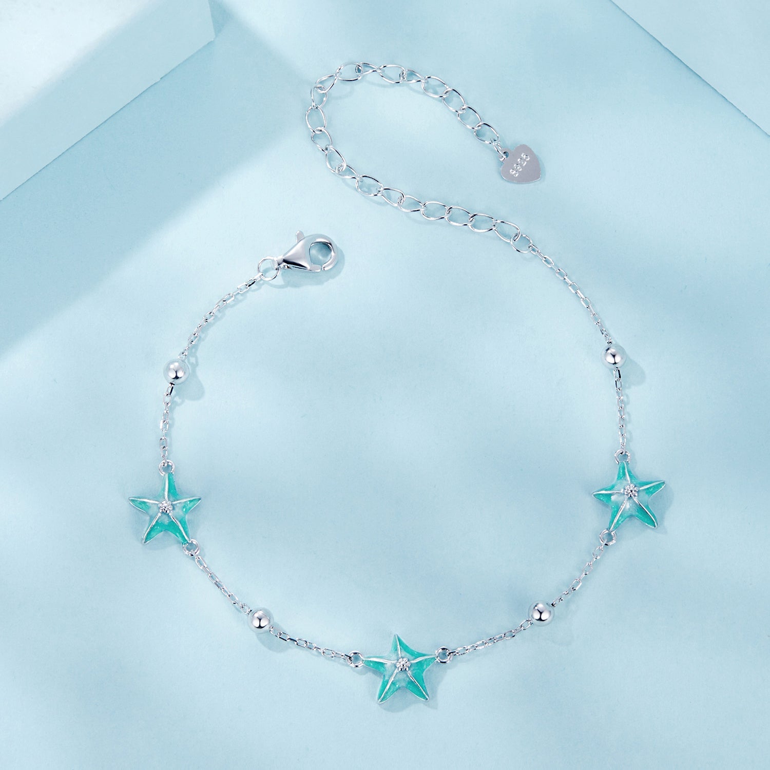Sterling silver starfish enamel bracelet with 3 turquoise starfish charms on a delicate chain on Tampa Home & Garden Store