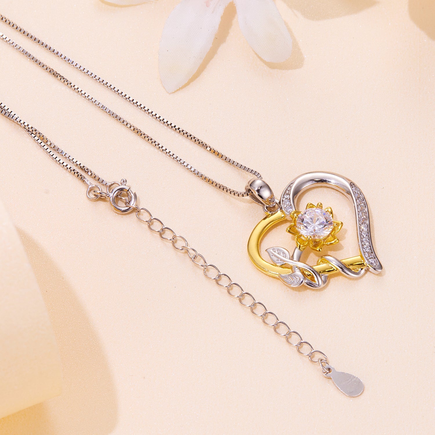 Two-tone moissanite necklace with pavé setting, gold flower and silver arc by Bids.com on Tampa Home & Garden Store