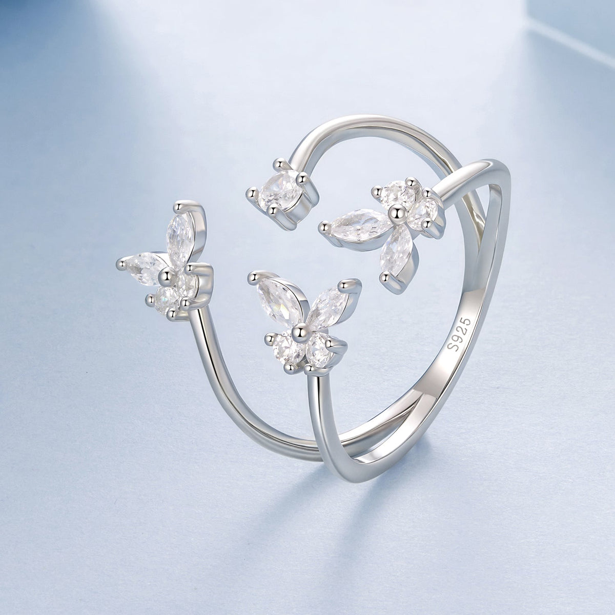 3-ring set of 925 sterling silver pavé CZ rings in white gold plating with flower cluster designs on Tampa Home & Garden Store