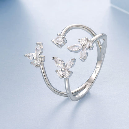 3-ring set of 925 sterling silver pavé CZ rings in white gold plating with flower cluster designs on Tampa Home & Garden Store
