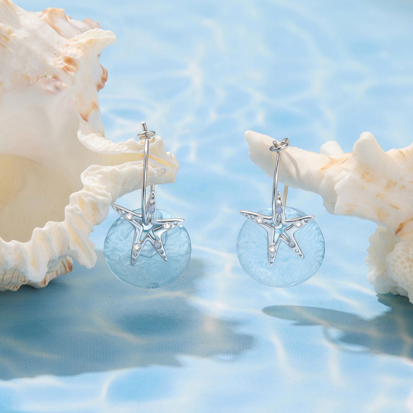 Earrings pair 925 Sterling Silver with nano opal and CZ, blue disc starfish motif, white gold on Tampa Home & Garden Store