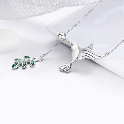 Sterling silver necklace with two pendants: bird and green-stone leaf charm for women on Tampa Home & Garden Store