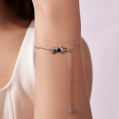 Sterling silver bracelet with two charms: cat charm and dangling blue heart pendant on Tampa Home & Garden Store