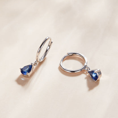 Pair of 925 sterling silver earrings with pavé blue CZ teardrop stones on Tampa Home & Garden Store