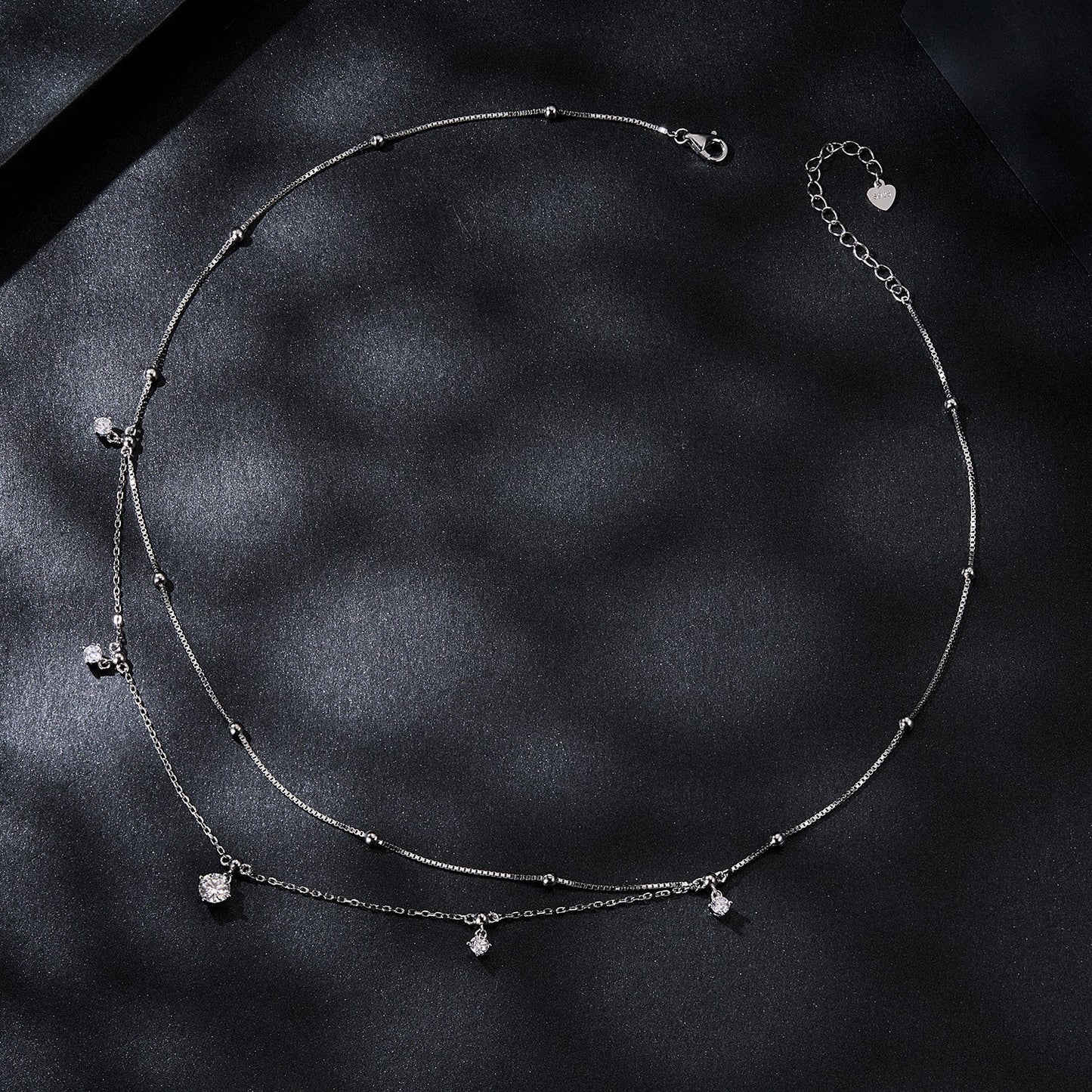 925 Sterling Silver Plated Moissanite Necklace with drops and adjustable extender on satin backdrop on Tampa Home & Garden Store