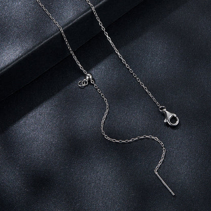 Sterling silver moissanite necklace with heart charm and pendant on glitter backdrop on Tampa Home & Garden Store