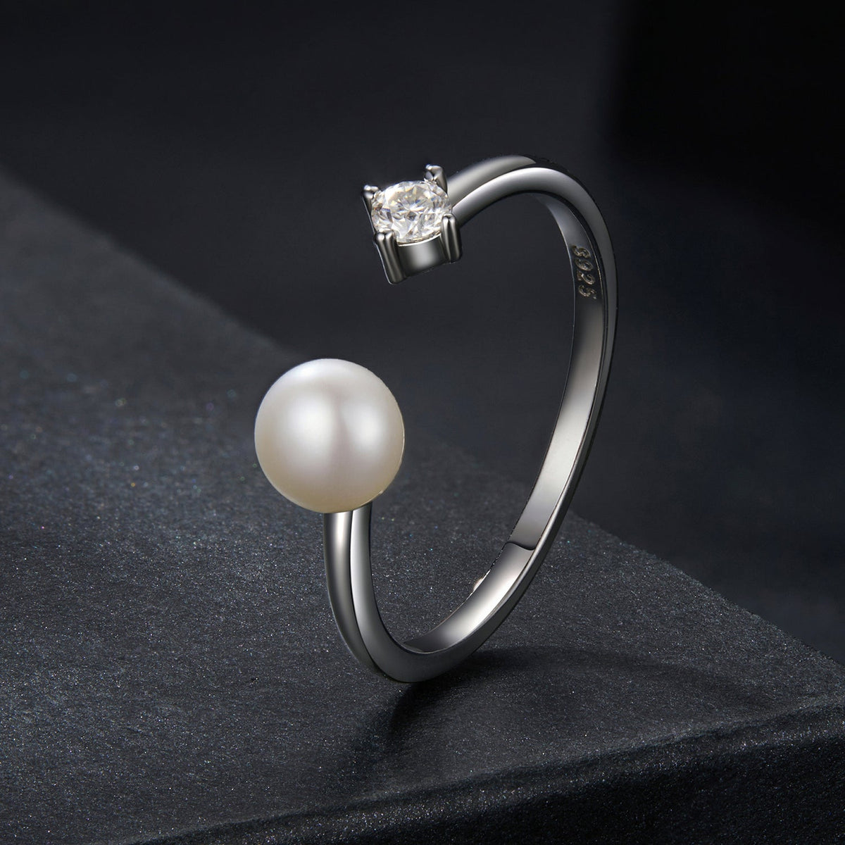 Sterling silver ring with a round moissanite center stone and a shell pearl accent, size E on Tampa Home & Garden Store