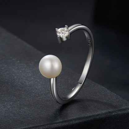 Sterling silver ring with a round moissanite center stone and a shell pearl accent, size E on Tampa Home & Garden Store