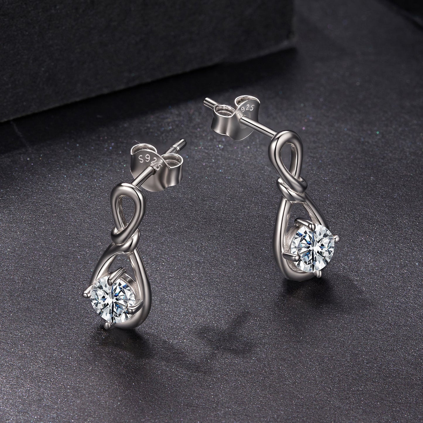 Pair of Sterling silver moissanite earrings with knot design and 0.5ct stone by Bids.com on Tampa Home & Garden Store