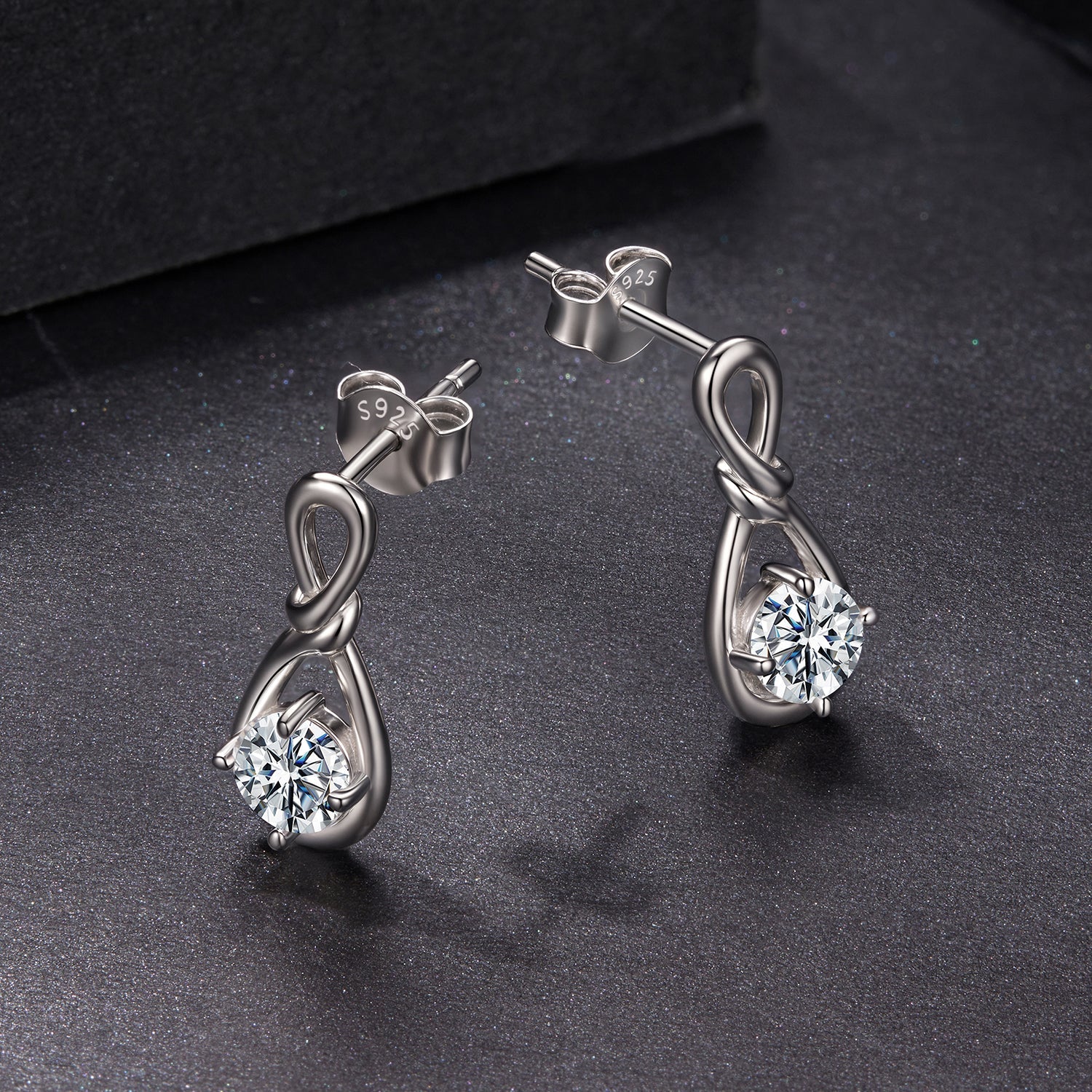 Pair of Sterling silver moissanite earrings with knot design and 0.5ct stone by Bids.com on Tampa Home & Garden Store