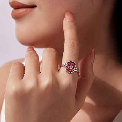 Sterling silver ring with red enamel flower centerpiece and scalloped edge worn on finger on Tampa Home & Garden Store
