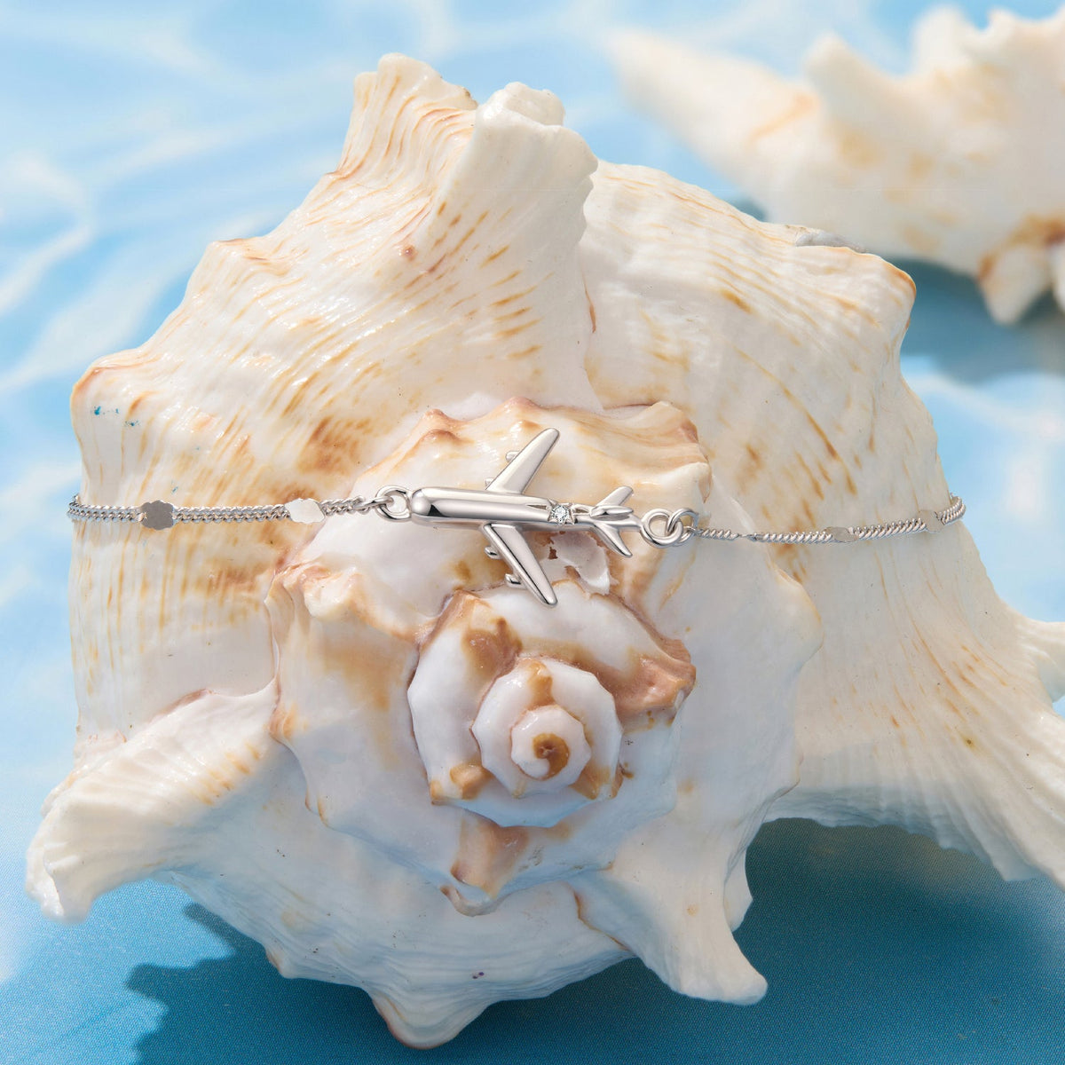 Bracelet with airplane CZ pendant, 925 silver white gold plated, 16+5cm, seashell backdrop on Tampa Home & Garden Store