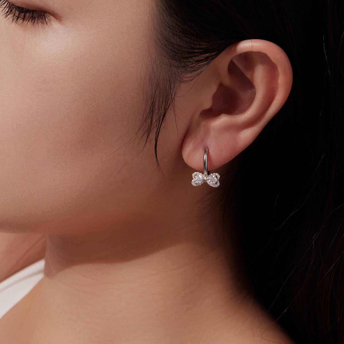 Moissanite bow earrings in 925 sterling silver, 0.20 ct, white gold plated on small hoop on Tampa Home & Garden Store