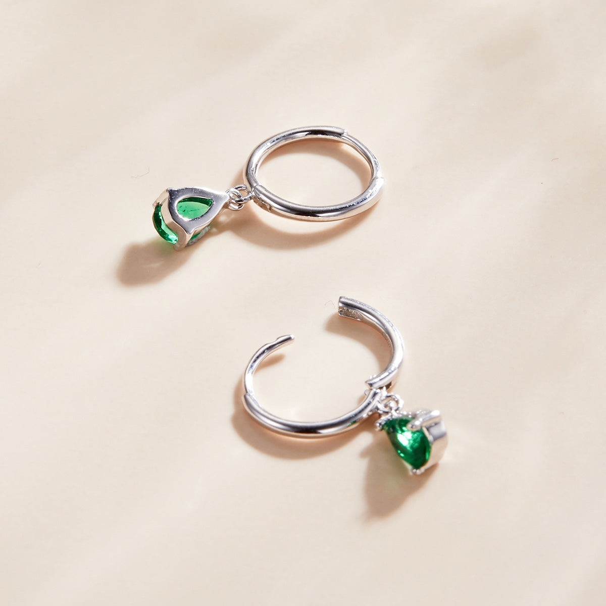 Pair of 925 sterling silver hoop earrings with green teardrop gemstone charms on Tampa Home & Garden Store