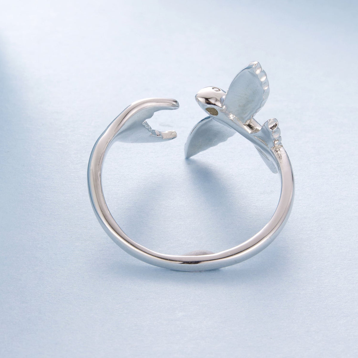 Sterling silver ring with white enamel butterfly motif and pavé CZ accents, open band on Tampa Home & Garden Store
