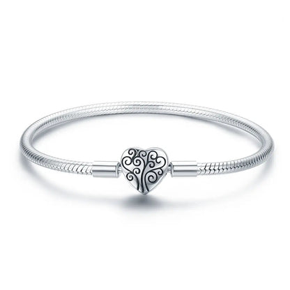 SCB 925 Bids.com sterling silver bracelet with heart charm and swirl tree motif, size 17 on Tampa Home & Garden Store