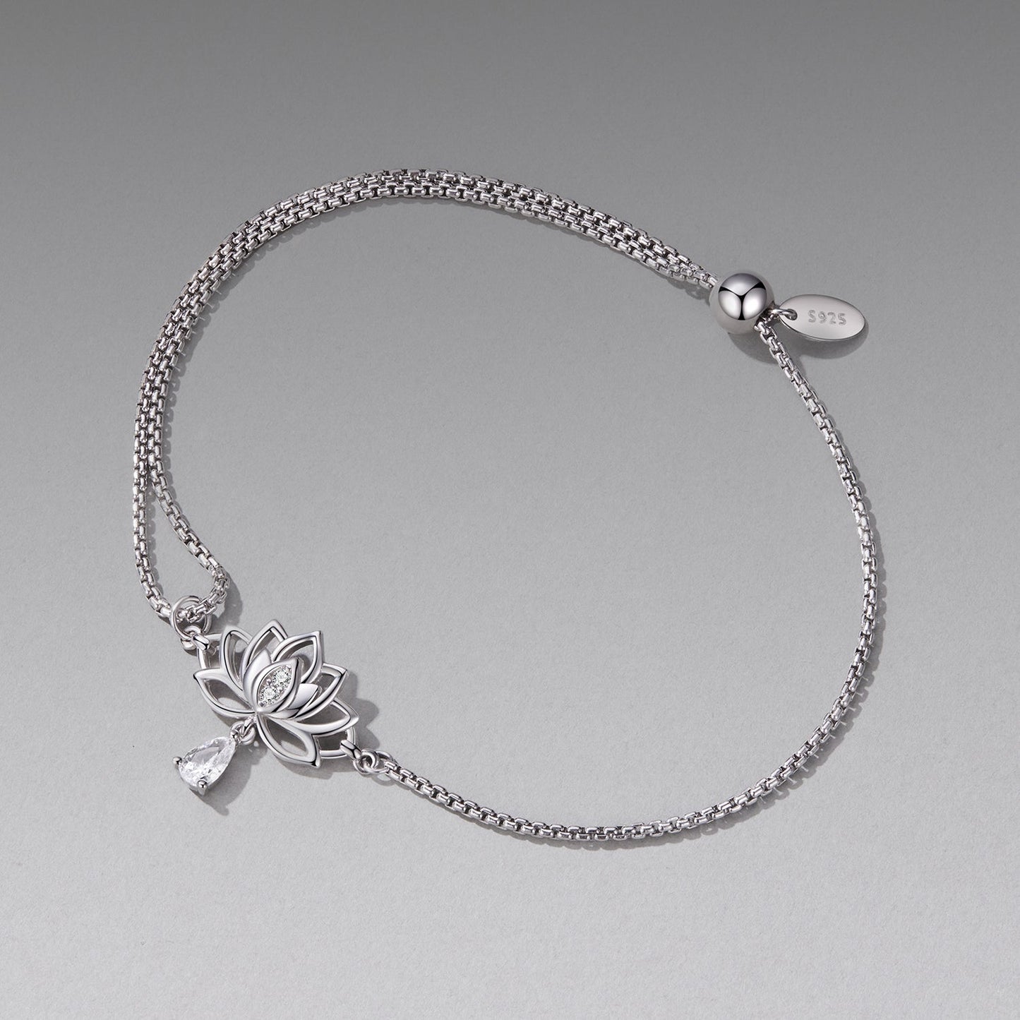 Sterling silver adjustable chain bracelet by Bids.com with CZ and lotus charm crystal pendant on Tampa Home & Garden Store