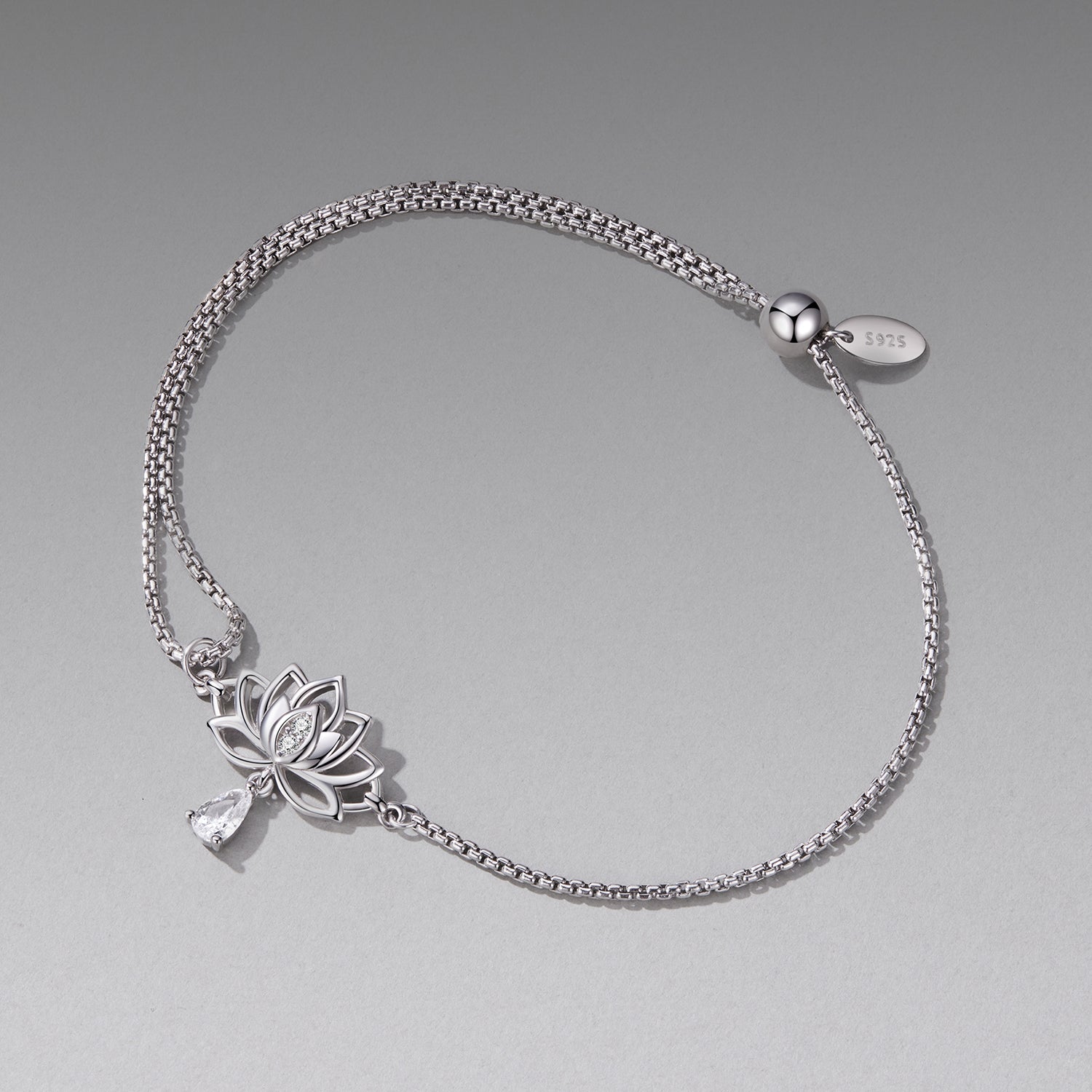 Sterling silver adjustable chain bracelet by Bids.com with CZ and lotus charm crystal pendant on Tampa Home & Garden Store