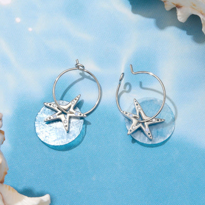Pair of 925 sterling silver hoop earrings with white gold plated starfish charms and CZ stones on Tampa Home & Garden Store