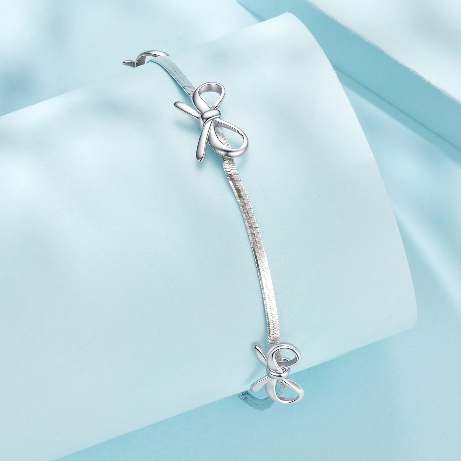 Bracelet 925 sterling silver with white gold plating, adjustable snake-chain, silver bow charm on Tampa Home & Garden Store