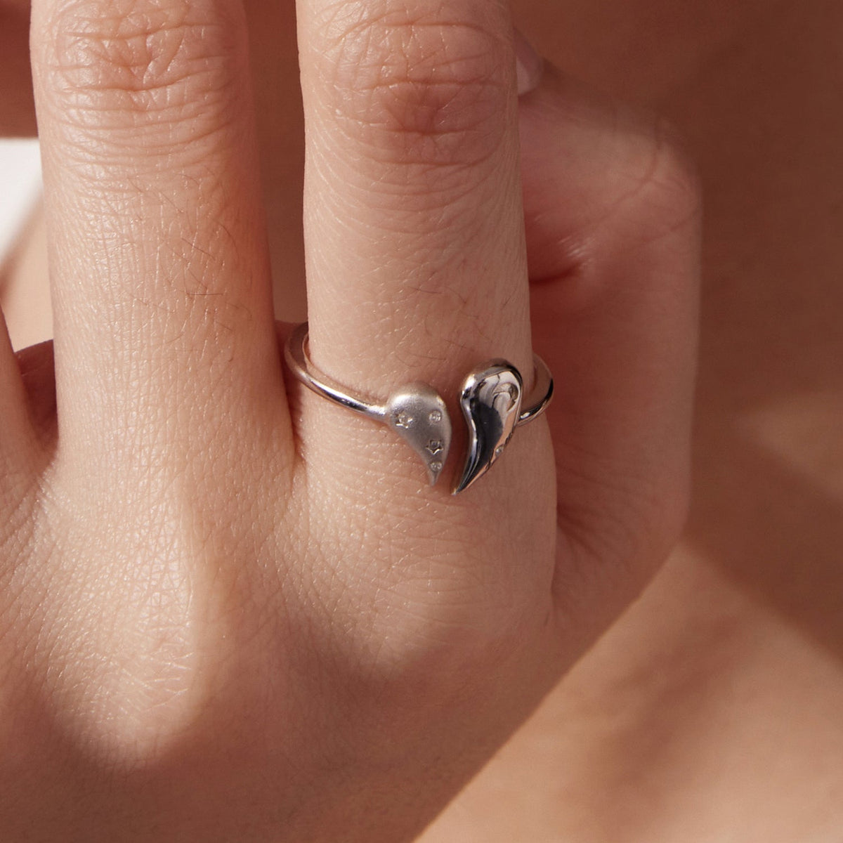 925 sterling silver ring with heart-shaped ends and CZ, white gold plated on Tampa Home & Garden Store