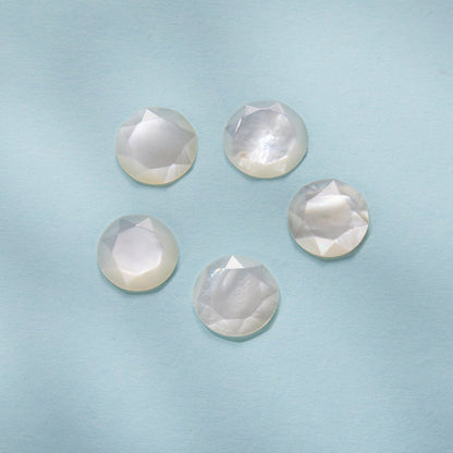 Six round faceted nacre stones with iridescent white sheen on Tampa Home & Garden Store