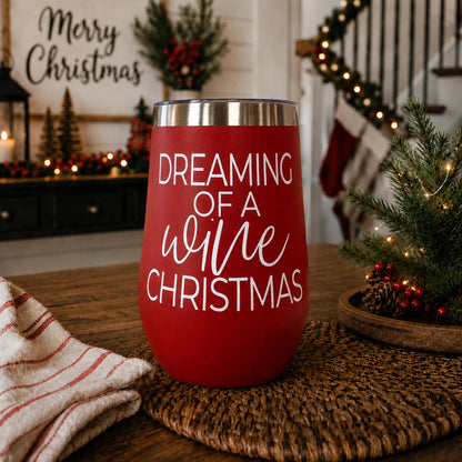 Red 17oz tumbler with silver rim displaying Dreaming of a wine Christmas on a holiday table on Tampa Home & Garden Store