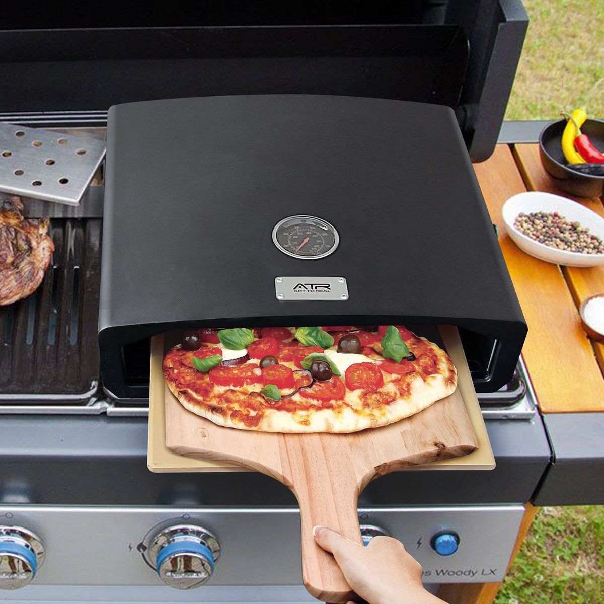 Portable outdoor pizza oven by Mercantile Mountain, matte black with round gauge on lid on Tampa Home & Garden Store