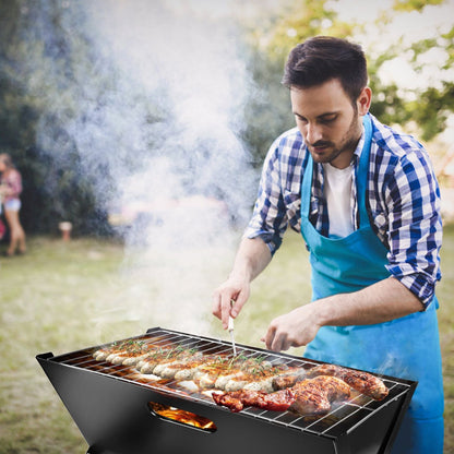 Foldable charcoal BBQ grill with portable triangle design grilling meats outdoors on Tampa Home & Garden Store