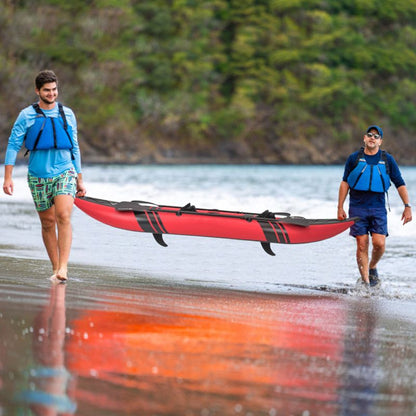 Mercantile Mountain inflatable 2-person kayak red with black aluminium oars carried on beach on Tampa Home & Garden Store