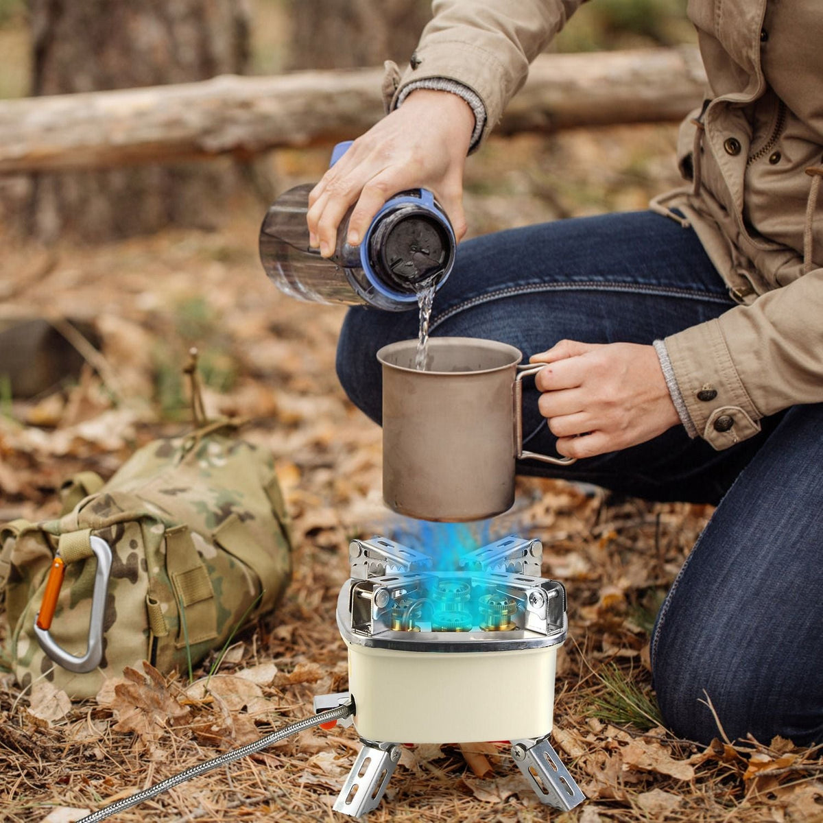 13000W portable windproof camping stove with cream base and blue burner in outdoor setting on Tampa Home & Garden Store