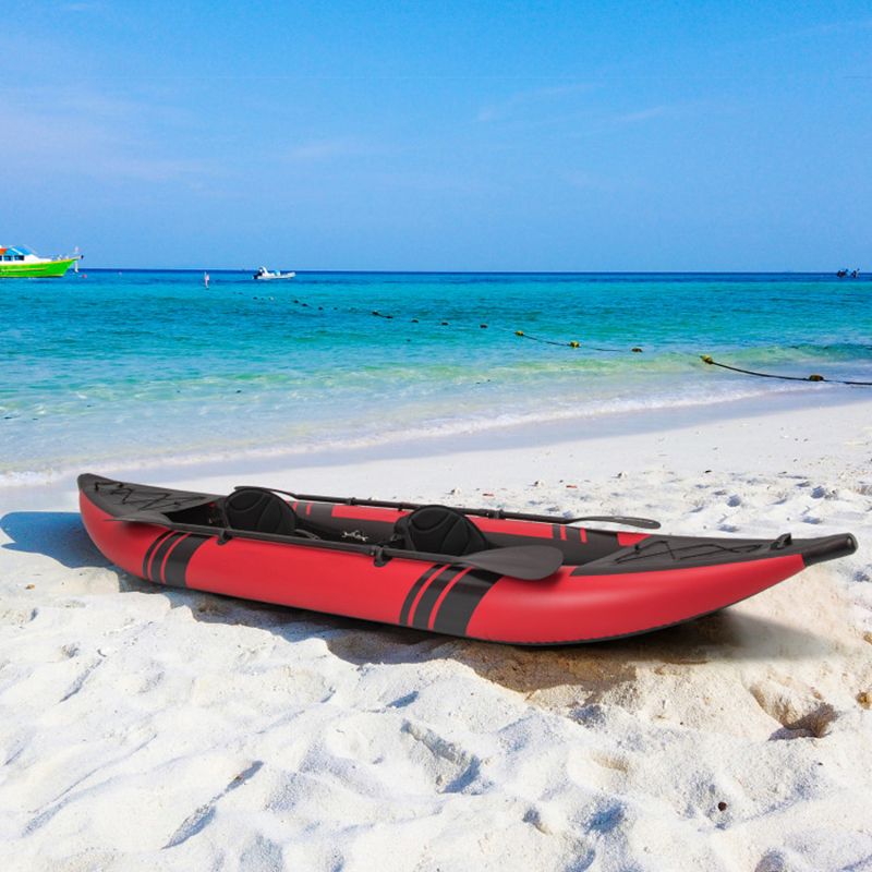 Mercantile Mountain inflatable 2-person kayak in red with black accents on sandy beach on Tampa Home & Garden Store