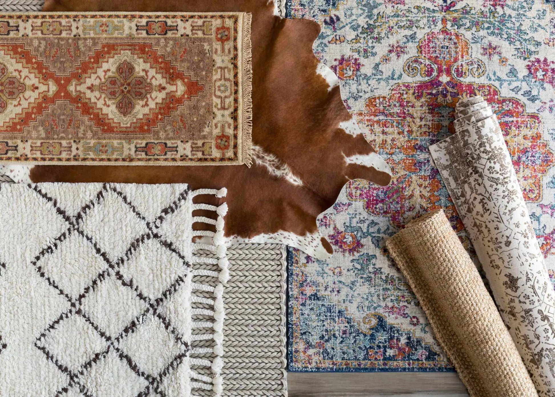 Herndon Braided Jute Rug by Boutique Rugs in brown braided texture with other rugs on Tampa Home & Garden Store