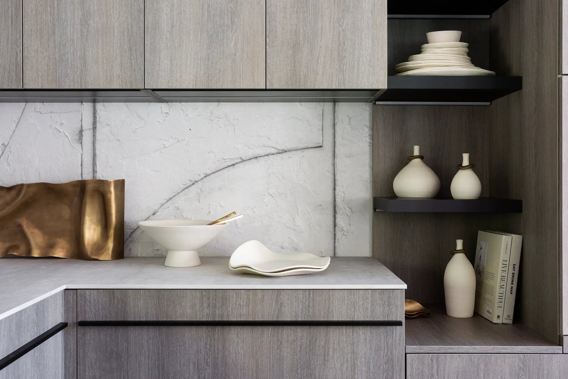 Sidney Servers cream ceramic serveware by dumæ on dark wood cabinets with stacked plates on Tampa Home & Garden Store