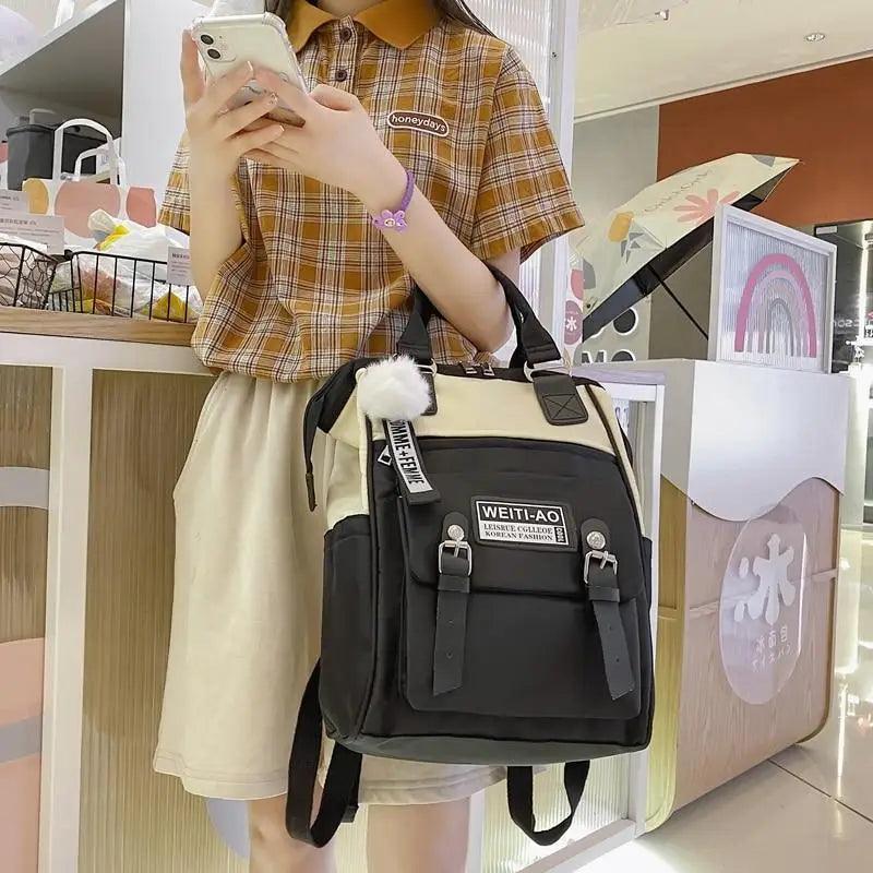 Stevvex laptop backpack beige and black with buckle pockets and fluffy pom-pom on Tampa Home & Garden Store